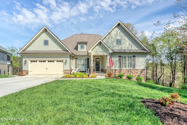 craftsman house with roof with shingles, driveway, stone siding, a front lawn, and a garage