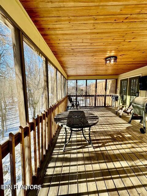 sunroom with wooden ceiling