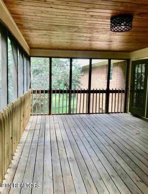 unfurnished sunroom featuring a sauna and a healthy amount of sunlight