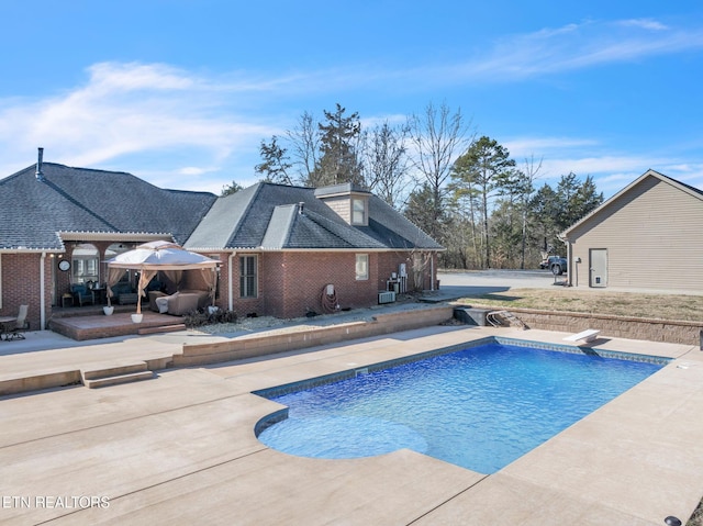 pool featuring a patio, a diving board, and a pergola