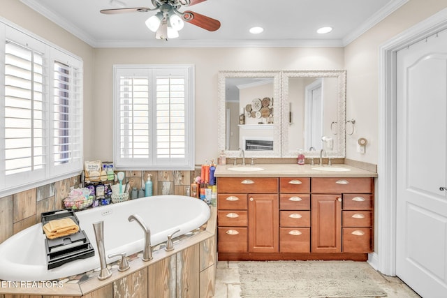 bathroom featuring a sink, a ceiling fan, a relaxing tiled tub, and double vanity
