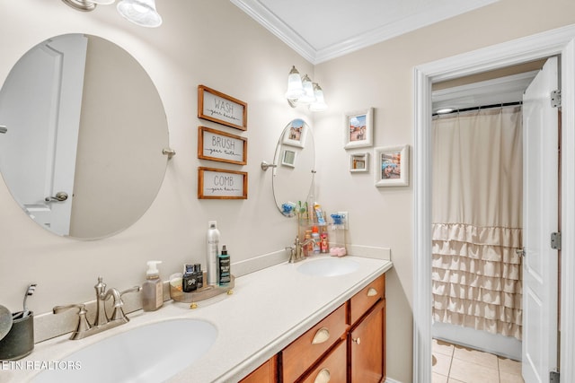 bathroom with tile patterned floors, double vanity, a sink, and ornamental molding