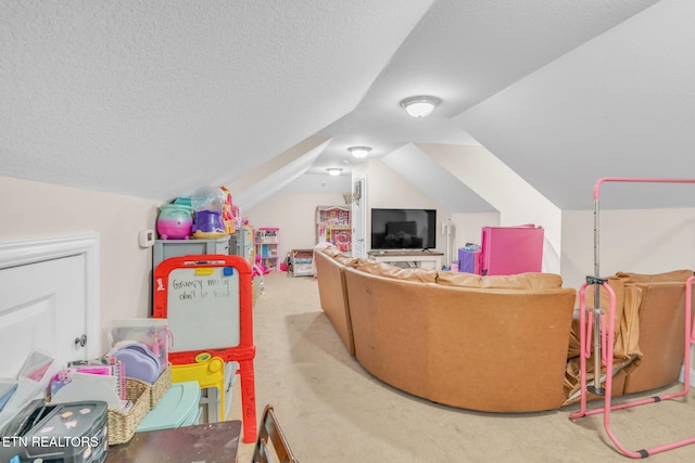 playroom with carpet flooring, vaulted ceiling, and a textured ceiling