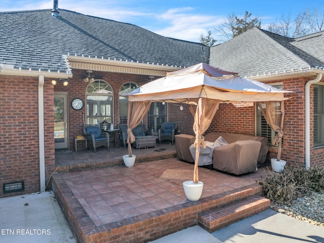 view of patio / terrace with an outdoor living space and a gazebo