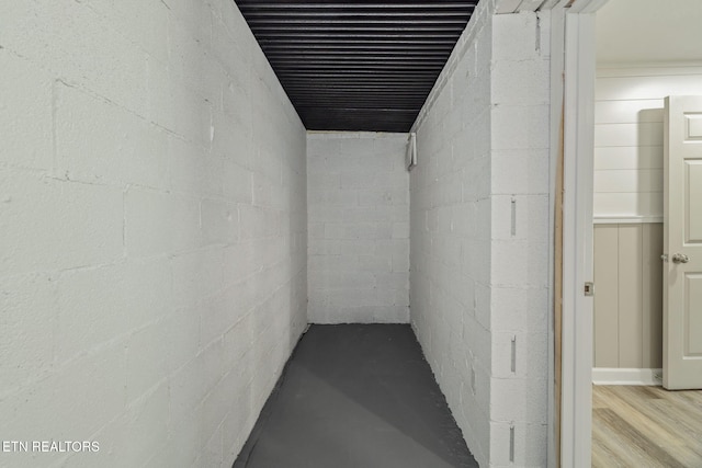 hall with concrete block wall