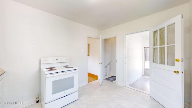 kitchen with white range with electric stovetop
