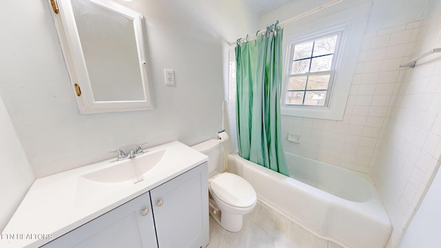 full bath featuring shower / bath combo with shower curtain, vanity, and toilet