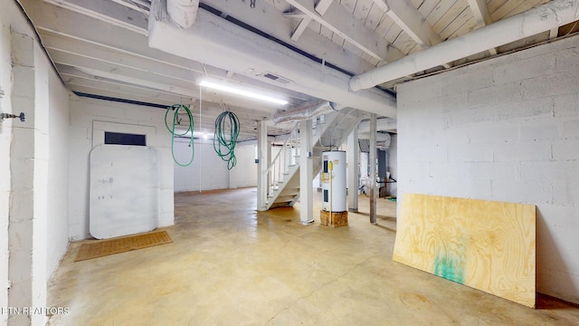 unfinished below grade area with water heater and stairs