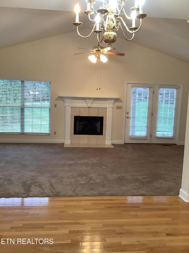 11608 San Martin Ln, Knoxville, TN 37934 - unfurnished living room with lofted ceiling, a chandelier, baseboards, carpet floors, and ceiling fan