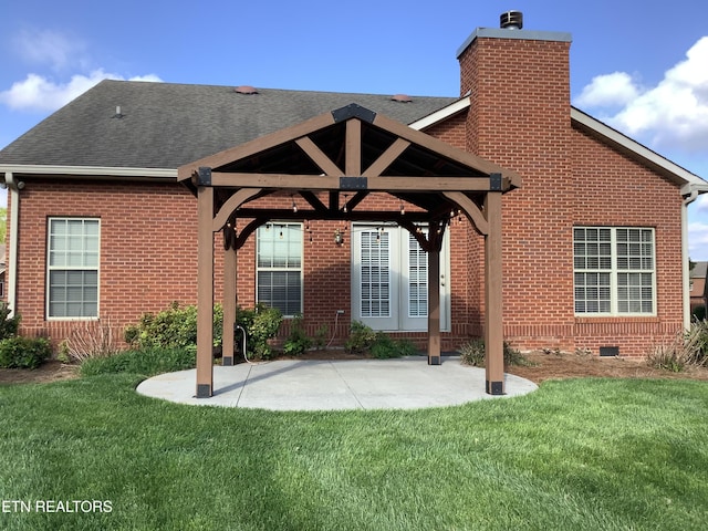 11608 San Martin Ln, Knoxville, TN 37934 - back of property with a chimney, roof with shingles, brick siding, and a yard