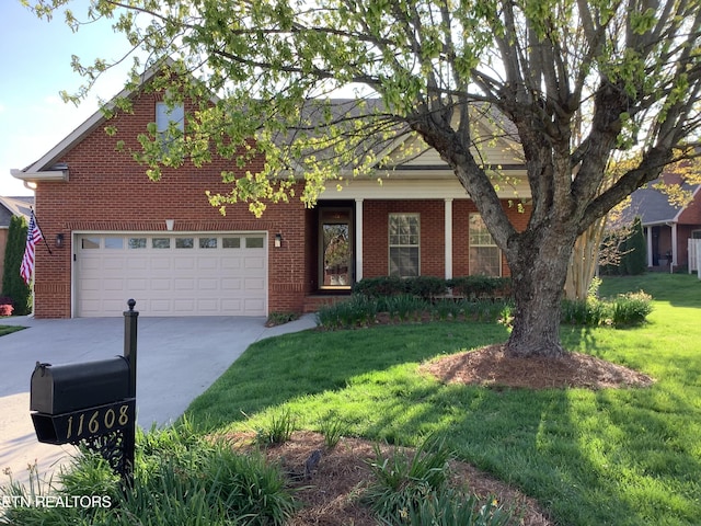 11608 San Martin Ln, Knoxville, TN 37934 - view of front of property featuring brick siding, driveway, a front lawn, and a garage