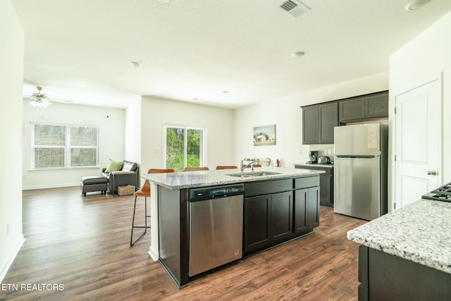 1133 Beacon Rd, Sevierville, TN 37876 - kitchen featuring open floor plan, visible vents, a center island with sink, stainless steel appliances, and a sink
