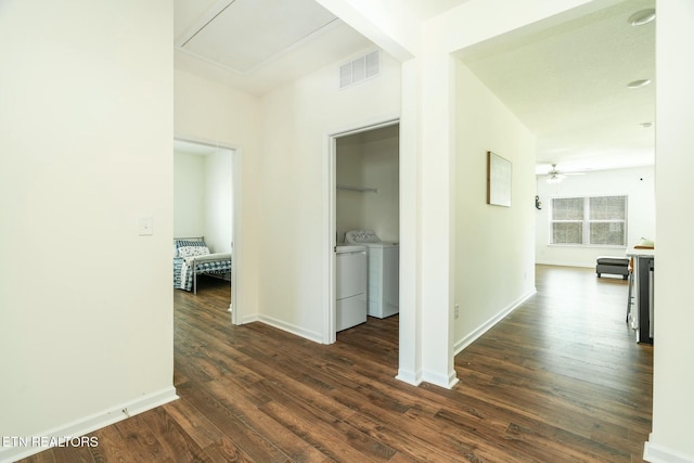 1133 Beacon Rd, Sevierville, TN 37876 - hall with separate washer and dryer, baseboards, attic access, dark wood-type flooring, and visible vents