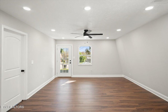 spare room with recessed lighting, dark wood-style floors, baseboards, and a ceiling fan