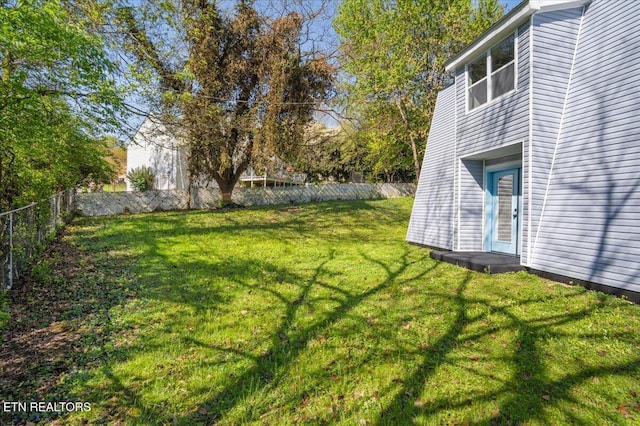 view of yard with a fenced backyard