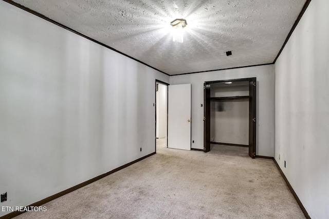 unfurnished bedroom featuring baseboards, carpet flooring, and a textured ceiling