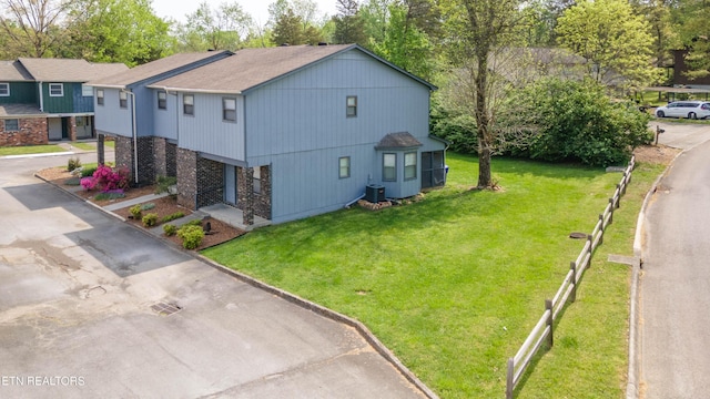 98 Hampshire Cir, Oak Ridge, TN 37830 - view of side of property with a lawn, fence, and cooling unit