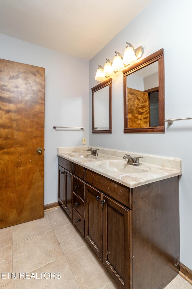 98 Hampshire Cir, Oak Ridge, TN 37830 - full bath with double vanity, tile patterned floors, baseboards, and a sink