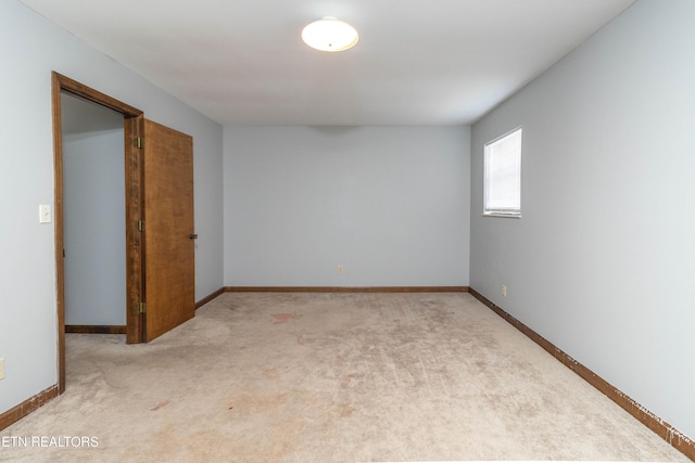 98 Hampshire Cir, Oak Ridge, TN 37830 - unfurnished room with baseboards and light carpet