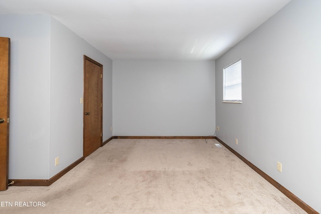 98 Hampshire Cir, Oak Ridge, TN 37830 - unfurnished room with baseboards and light colored carpet