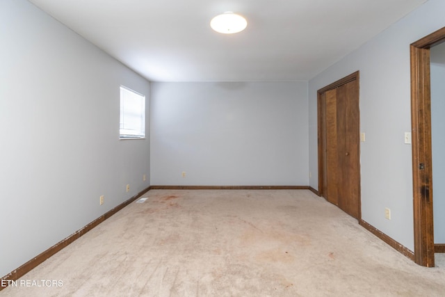 98 Hampshire Cir, Oak Ridge, TN 37830 - spare room featuring baseboards and carpet flooring