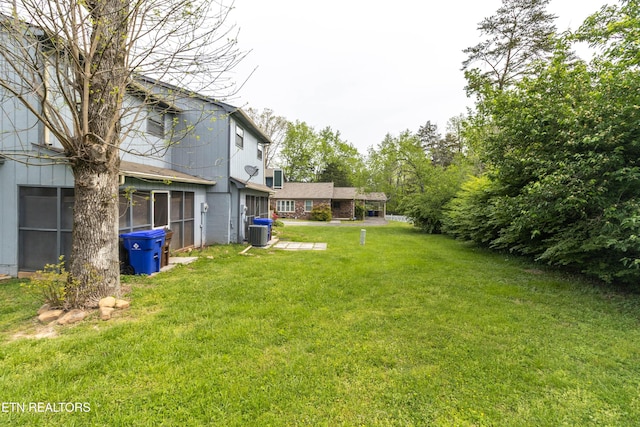 98 Hampshire Cir, Oak Ridge, TN 37830 - view of yard featuring central AC and a sunroom
