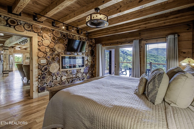 3505 Mountain Tyme Way, Sevierville, TN 37862 - bedroom featuring wood ceiling, track lighting, beamed ceiling, access to outside, and hardwood / wood-style flooring
