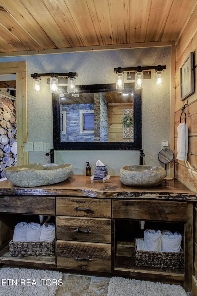 3505 Mountain Tyme Way, Sevierville, TN 37862 - full bathroom featuring a sink, double vanity, a textured wall, and wood ceiling