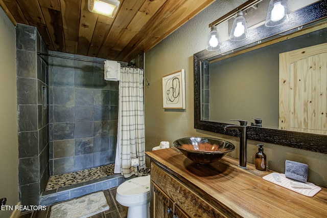 3505 Mountain Tyme Way, Sevierville, TN 37862 - full bathroom featuring toilet, wood ceiling, a tile shower, a textured wall, and vanity