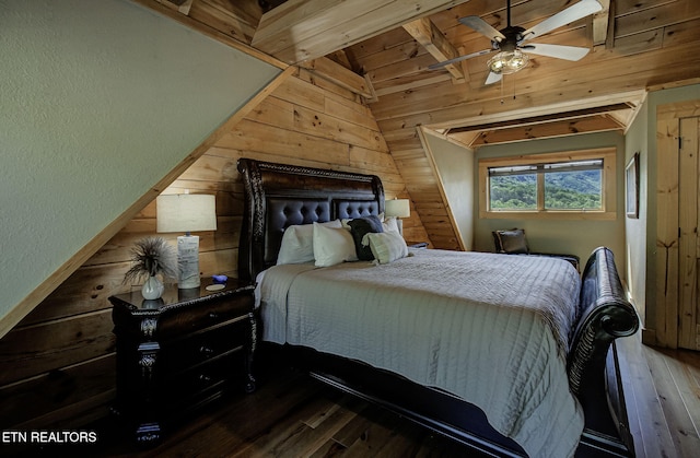 3505 Mountain Tyme Way, Sevierville, TN 37862 - bedroom with vaulted ceiling, wood walls, wood-type flooring, and a textured wall