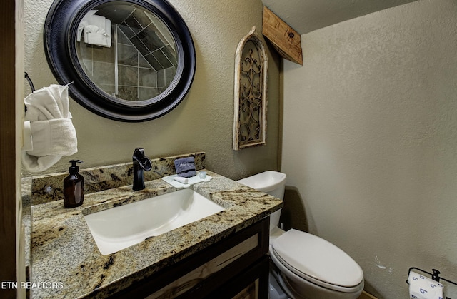 3505 Mountain Tyme Way, Sevierville, TN 37862 - half bathroom featuring toilet, vanity, and a textured wall