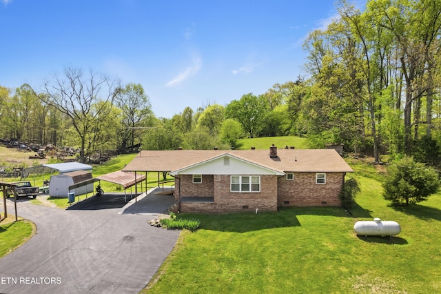 139 Hearon Rd, Kingston, TN 37763 - view of front facade with a detached carport, a chimney, driveway, crawl space, and a front yard