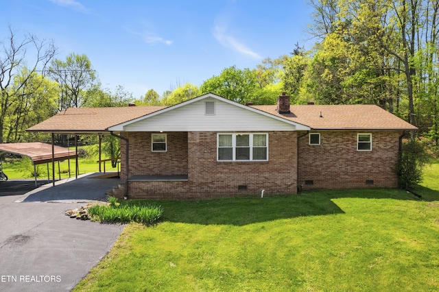 139 Hearon Rd, Kingston, TN 37763 - view of home's exterior with roof with shingles, crawl space, aphalt driveway, brick siding, and a yard