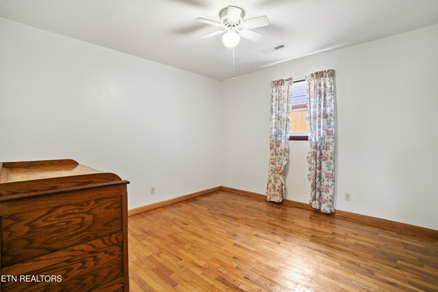 139 Hearon Rd, Kingston, TN 37763 - unfurnished room with visible vents, light wood-style flooring, a ceiling fan, and baseboards