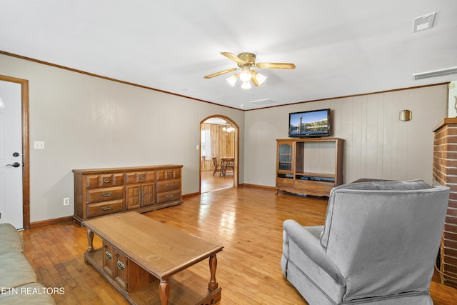 139 Hearon Rd, Kingston, TN 37763 - living room with light wood-style flooring, arched walkways, ceiling fan, and ornamental molding