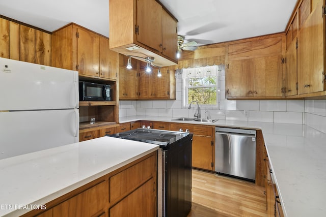 139 Hearon Rd, Kingston, TN 37763 - kitchen with a sink, freestanding refrigerator, electric stove, black microwave, and stainless steel dishwasher
