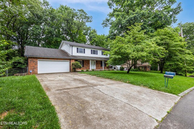 1104 Burning Tree Ln, Knoxville, TN 37923 - traditional-style home featuring brick siding, driveway, a garage, and a porch