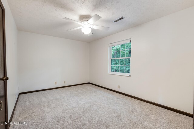1104 Burning Tree Ln, Knoxville, TN 37923 - carpeted empty room featuring a ceiling fan, baseboards, and a textured ceiling