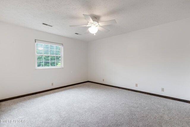 1104 Burning Tree Ln, Knoxville, TN 37923 - carpeted empty room featuring a ceiling fan, baseboards, and a textured ceiling