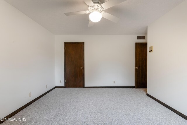 1104 Burning Tree Ln, Knoxville, TN 37923 - empty room featuring carpet, a ceiling fan, and baseboards