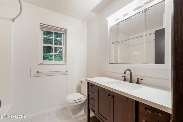 1104 Burning Tree Ln, Knoxville, TN 37923 - bathroom featuring toilet, vanity, a shower, and baseboards