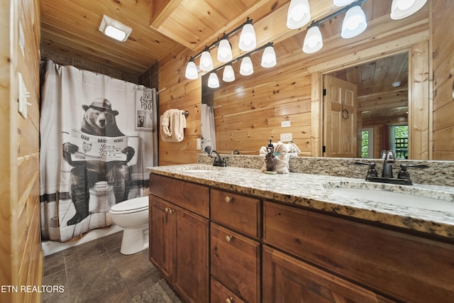 bathroom with wood walls, toilet, wood ceiling, and a sink