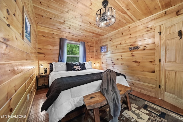 bedroom with wood ceiling, wooden walls, and wood-type flooring