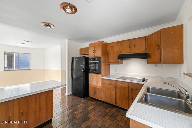 kitchen featuring range hood, a sink, light countertops, brown cabinetry, and black appliances