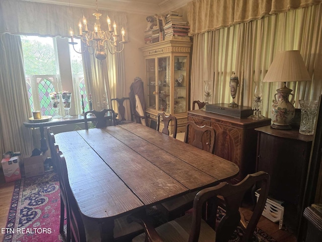 1000 Biddle St, Knoxville, TN 37914 - dining room with an inviting chandelier and ornamental molding