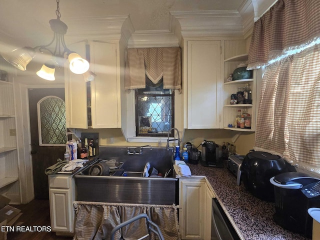 1000 Biddle St, Knoxville, TN 37914 - kitchen with stainless steel dishwasher, dark countertops, crown molding, open shelves, and decorative light fixtures