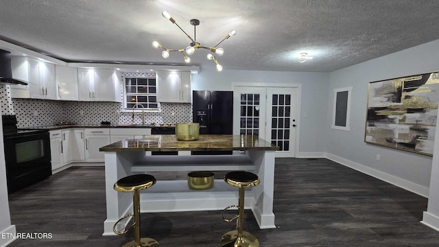 101 Old Vasper Rd, Caryville, TN 37714 - kitchen with a textured ceiling, white cabinetry, black appliances, and dark countertops