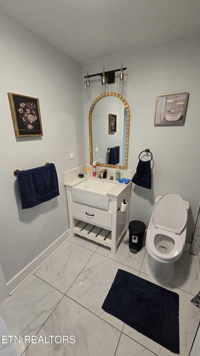 101 Old Vasper Rd, Caryville, TN 37714 - bathroom featuring toilet, baseboards, marble finish floor, and vanity