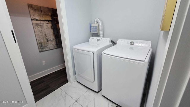 101 Old Vasper Rd, Caryville, TN 37714 - laundry room featuring washer and clothes dryer, marble finish floor, and laundry area