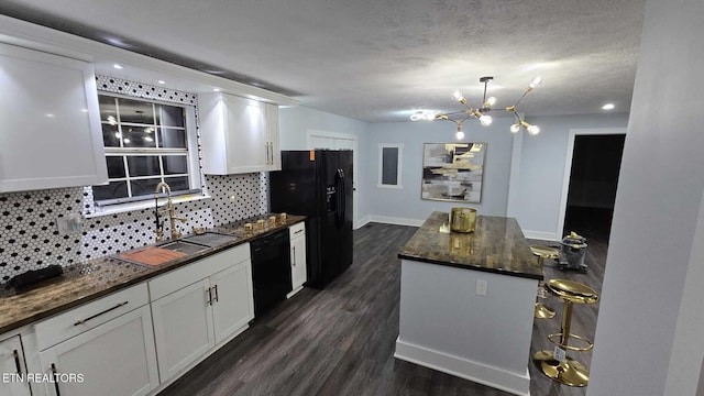 101 Old Vasper Rd, Caryville, TN 37714 - kitchen featuring tasteful backsplash, dark wood-style flooring, an inviting chandelier, black appliances, and a sink